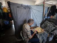 The Palestinian Yasser Abu Harbid, a 50-year-old displaced from northern Gaza to Deir al-Balah, lives in a school run by the United Nations...