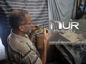 The Palestinian Yasser Abu Harbid, a 50-year-old displaced from northern Gaza to Deir al-Balah, lives in a school run by the United Nations...