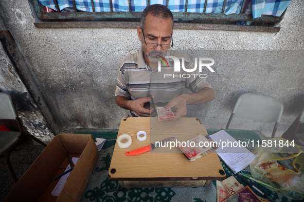 The Palestinian Yasser Abu Harbid, a 50-year-old displaced from northern Gaza to Deir al-Balah, lives in a school run by the United Nations...