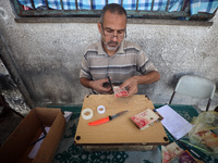 The Palestinian Yasser Abu Harbid, a 50-year-old displaced from northern Gaza to Deir al-Balah, lives in a school run by the United Nations...