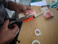 The Palestinian Yasser Abu Harbid, a 50-year-old displaced from northern Gaza to Deir al-Balah, lives in a school run by the United Nations...