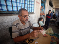 The Palestinian Yasser Abu Harbid, a 50-year-old displaced from northern Gaza to Deir al-Balah, lives in a school run by the United Nations...