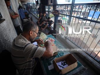 The Palestinian Yasser Abu Harbid, a 50-year-old displaced from northern Gaza to Deir al-Balah, lives in a school run by the United Nations...