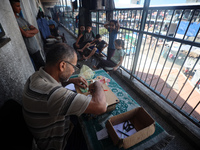 The Palestinian Yasser Abu Harbid, a 50-year-old displaced from northern Gaza to Deir al-Balah, lives in a school run by the United Nations...