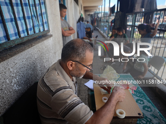 The Palestinian Yasser Abu Harbid, a 50-year-old displaced from northern Gaza to Deir al-Balah, lives in a school run by the United Nations...