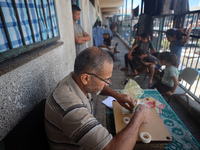 The Palestinian Yasser Abu Harbid, a 50-year-old displaced from northern Gaza to Deir al-Balah, lives in a school run by the United Nations...