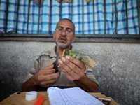 The Palestinian Yasser Abu Harbid, a 50-year-old displaced from northern Gaza to Deir al-Balah, lives in a school run by the United Nations...