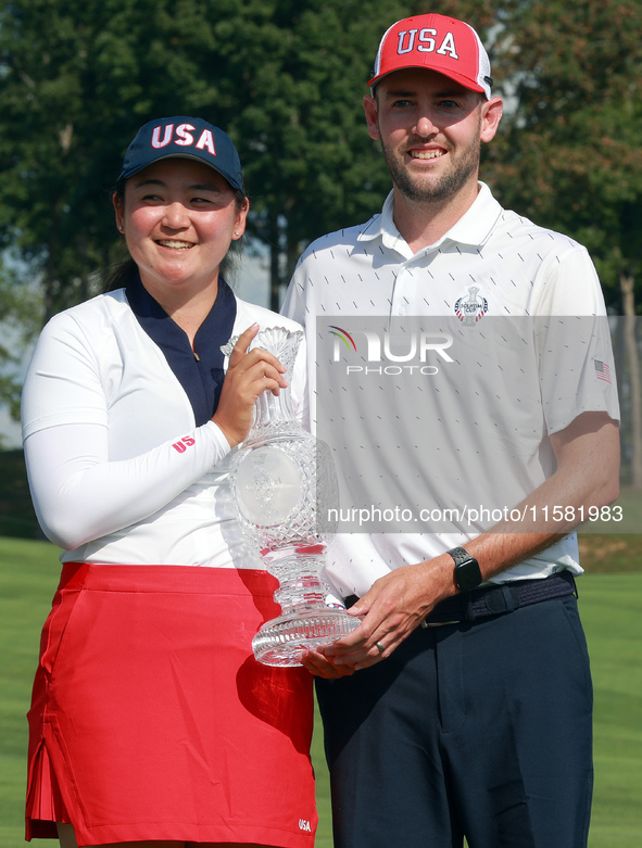 GAINESVILLE, VIRGINIA - SEPTEMBER 15: Allisen Corpuz of the United States poses with her caddie while holding the trophy after a Team USA wi...