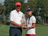 GAINESVILLE, VIRGINIA - SEPTEMBER 15: Andrea Lee of the United States poses with her caddie Robert Arft while holding the trophy after a Tea...