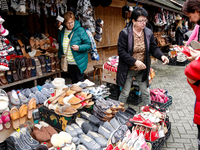 People buy winter sleepers on a landmark Krupowki Street in the center of Zakopane, a popular Tatra mountain holiday resort as Autumn cold w...