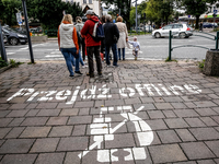 Walk offline sign is seen on a pavement on a landmark Krupowki Street in the center of Zakopane, a popular Tatra mountain holiday resort as...