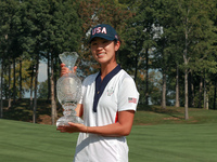 GAINESVILLE, VIRGINIA - SEPTEMBER 15: Andrea Lee of the United States poses with the trophy after a Team USA win at the conclusion of the So...