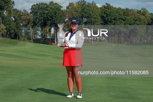 GAINESVILLE, VIRGINIA - SEPTEMBER 15: Lilia Vu of Team USA poses with the trophy after a Team USA win at the conclusion of the Solheim Cup a...