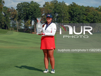 GAINESVILLE, VIRGINIA - SEPTEMBER 15: Lilia Vu of Team USA poses with the trophy after a Team USA win at the conclusion of the Solheim Cup a...