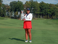 GAINESVILLE, VIRGINIA - SEPTEMBER 15: Lilia Vu of Team USA poses with the trophy after a Team USA win at the conclusion of the Solheim Cup a...