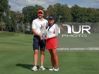 GAINESVILLE, VIRGINIA - SEPTEMBER 15: Lilia Vu of Team USA poses with her caddie Cole Pensanti  while holding the trophy after a Team USA wi...