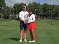 GAINESVILLE, VIRGINIA - SEPTEMBER 15: Lilia Vu of Team USA poses with her caddie Cole Pensanti  while holding the trophy after a Team USA wi...