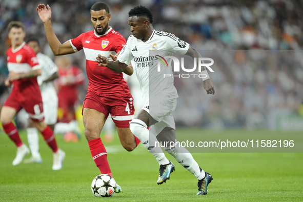 Vinicius Junior left winger of Real Madrid and Brazil and Josha Vagnoman right-back of Stuttgart and Germany compete for the ball during the...