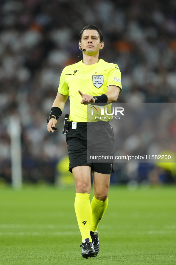 Referee Umut Meler of Turkiye during the UEFA Champions League 2024/25 League Phase MD1 match between Real Madrid C.F. and VfB Stuttgart at...