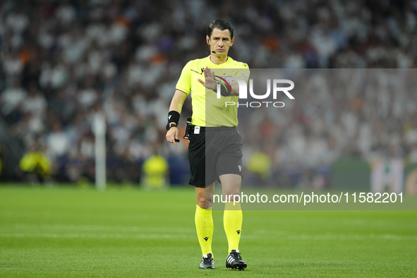 Referee Umut Meler of Turkiye during the UEFA Champions League 2024/25 League Phase MD1 match between Real Madrid C.F. and VfB Stuttgart at...