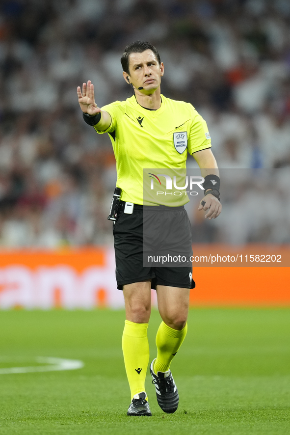 Referee Umut Meler of Turkiye during the UEFA Champions League 2024/25 League Phase MD1 match between Real Madrid C.F. and VfB Stuttgart at...