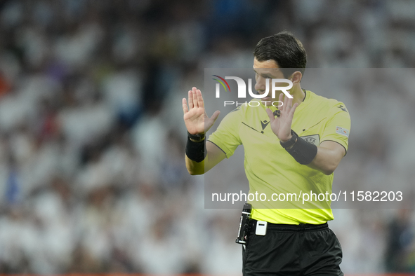 Referee Umut Meler of Turkiye during the UEFA Champions League 2024/25 League Phase MD1 match between Real Madrid C.F. and VfB Stuttgart at...