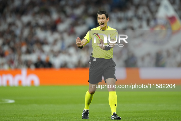 Referee Umut Meler of Turkiye during the UEFA Champions League 2024/25 League Phase MD1 match between Real Madrid C.F. and VfB Stuttgart at...