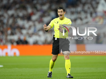 Referee Umut Meler of Turkiye during the UEFA Champions League 2024/25 League Phase MD1 match between Real Madrid C.F. and VfB Stuttgart at...