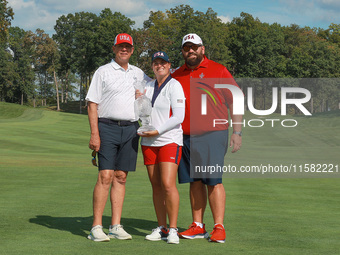 GAINESVILLE, VIRGINIA - SEPTEMBER 15: Lauren Coughlin of the United States poses with her significant other as well as her caddie while hold...