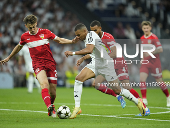 Kylian Mbappe centre-forward of Real Madrid and France and Anthony Rouault centre-back of Stuttgart and France compete for the ball during t...