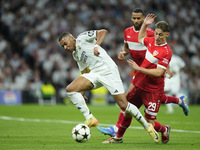 Kylian Mbappe centre-forward of Real Madrid and France and Anthony Rouault centre-back of Stuttgart and France compete for the ball during t...