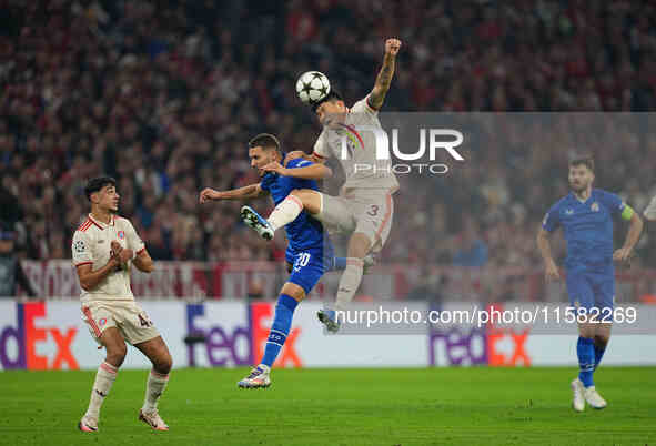 Minjae Kim of Bayern Munich and Marko Pjaca of GNK Dinamo battle for the ball  during the Champions League Round 1 match between Bayern Muni...