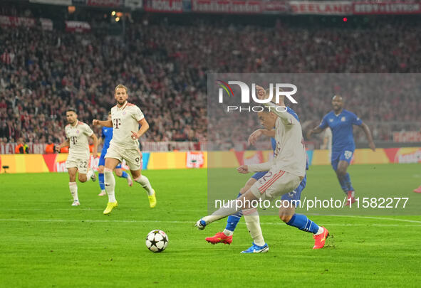 Jamal Musiala of Bayern Munich    shoots on goal  during the Champions League Round 1 match between Bayern Munich v Dinamo Zagreb, at the Al...