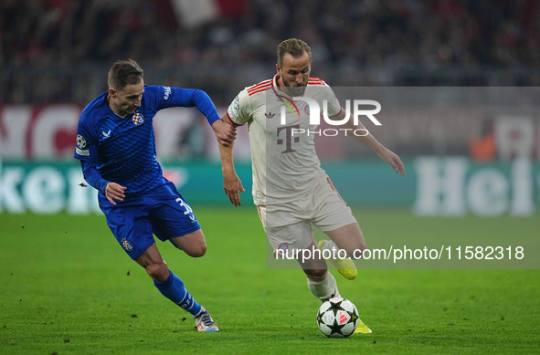 Harry Kane of Bayern Munich    controls the ball  during the Champions League Round 1 match between Bayern Munich v Dinamo Zagreb, at the Al...