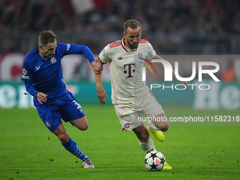 Harry Kane of Bayern Munich    controls the ball  during the Champions League Round 1 match between Bayern Munich v Dinamo Zagreb, at the Al...