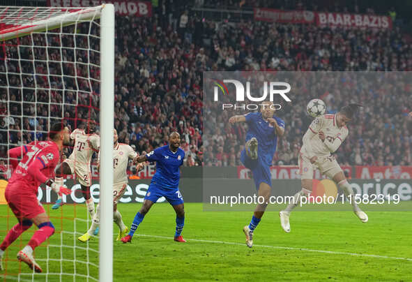 Michael Olise of Bayern Munich    scores the teams third goal  during the Champions League Round 1 match between Bayern Munich v Dinamo Zagr...