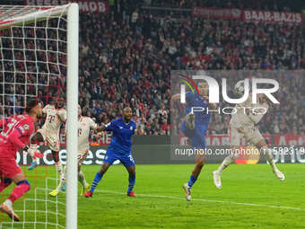 Michael Olise of Bayern Munich    scores the teams third goal  during the Champions League Round 1 match between Bayern Munich v Dinamo Zagr...