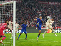 Michael Olise of Bayern Munich    scores the teams third goal  during the Champions League Round 1 match between Bayern Munich v Dinamo Zagr...