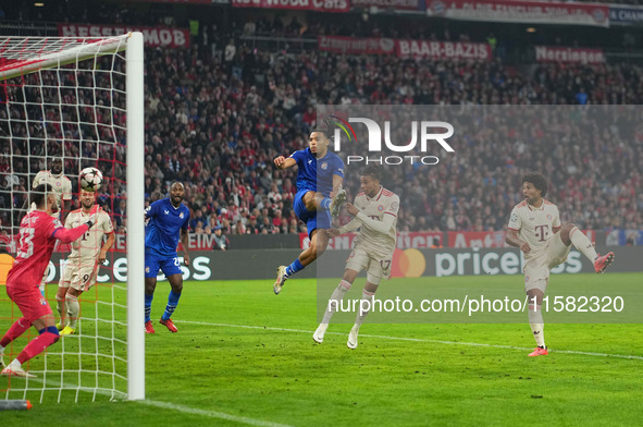 Michael Olise of Bayern Munich    scores the teams third goal  during the Champions League Round 1 match between Bayern Munich v Dinamo Zagr...