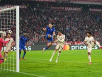 Michael Olise of Bayern Munich    scores the teams third goal  during the Champions League Round 1 match between Bayern Munich v Dinamo Zagr...