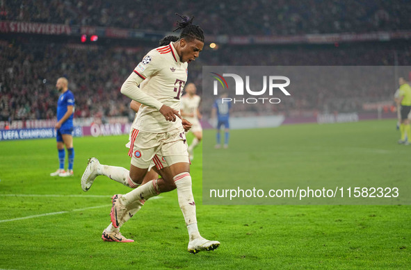 Michael Olise of Bayern Munich    celebrates  the teams third goal  during the Champions League Round 1 match between Bayern Munich v Dinamo...