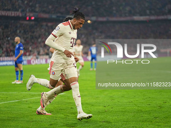 Michael Olise of Bayern Munich    celebrates  the teams third goal  during the Champions League Round 1 match between Bayern Munich v Dinamo...