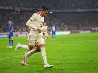 Michael Olise of Bayern Munich    celebrates  the teams third goal  during the Champions League Round 1 match between Bayern Munich v Dinamo...