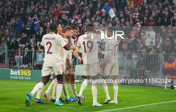 Michael Olise of Bayern Munich    celebrates  the teams third goal  during the Champions League Round 1 match between Bayern Munich v Dinamo...