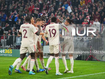 Michael Olise of Bayern Munich    celebrates  the teams third goal  during the Champions League Round 1 match between Bayern Munich v Dinamo...