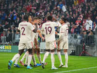 Michael Olise of Bayern Munich    celebrates  the teams third goal  during the Champions League Round 1 match between Bayern Munich v Dinamo...