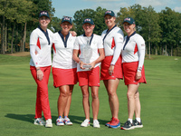 GAINESVILLE, VIRGINIA - SEPTEMBER 15: Team USA members pose as a group with the winners trophy, from left to right, Assistant Captain Paula...