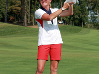 GAINESVILLE, VIRGINIA - SEPTEMBER 15: Team USA Captain Stacy Lewis raises the trophy at the conclusion of the Solheim Cup at Robert Trent Jo...