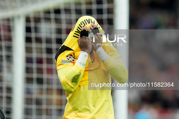 Mike Maignan of AC Milan leaves the pitch injured during the UEFA Champions League 2024/25 League Phase MD1 match between AC Milan and Liver...