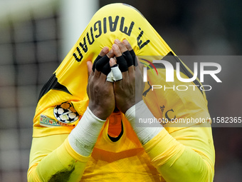 Mike Maignan of AC Milan leaves the pitch injured during the UEFA Champions League 2024/25 League Phase MD1 match between AC Milan and Liver...